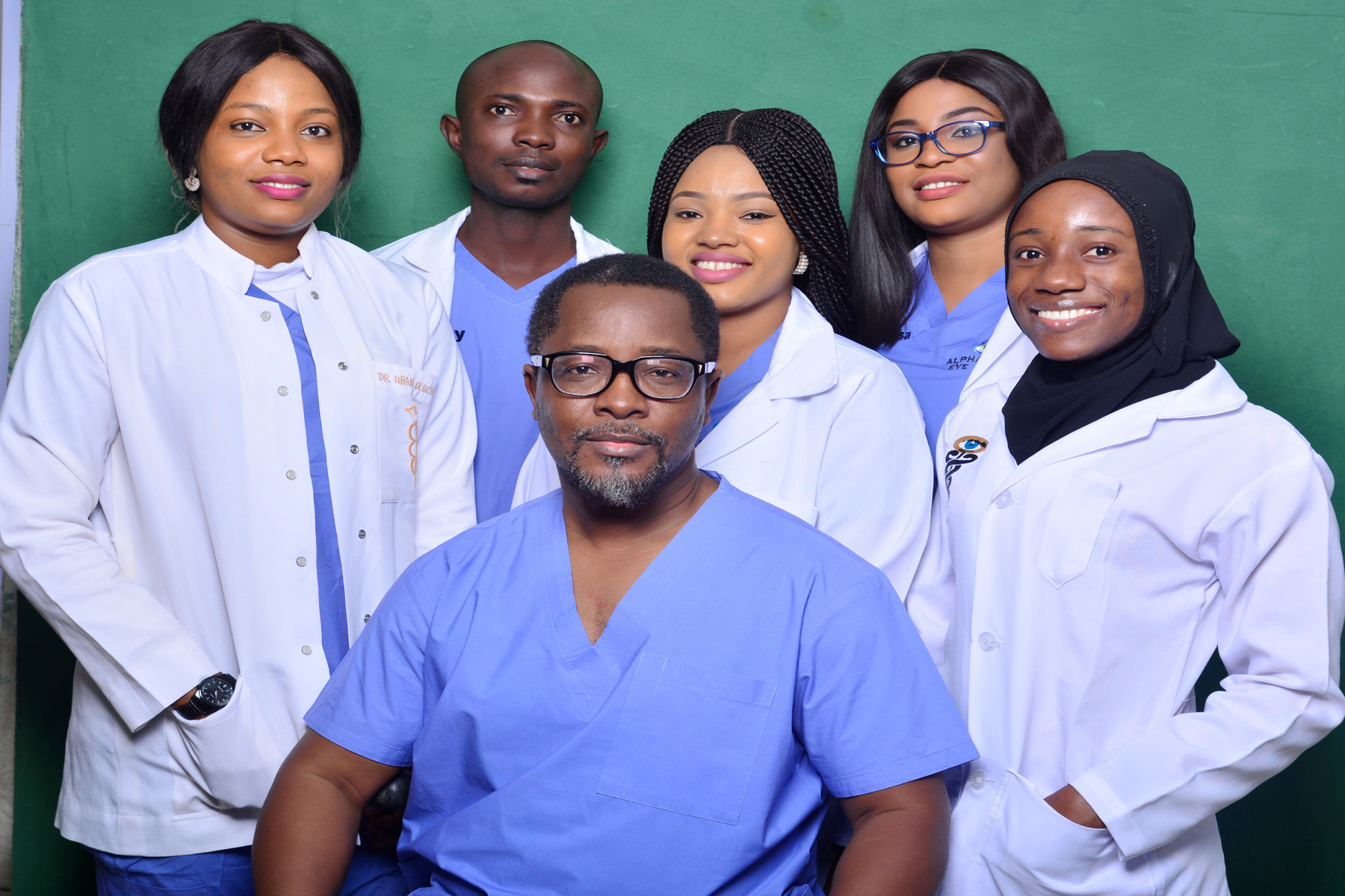 The best eye clinic in Abuja, with doctors posing for a photo.