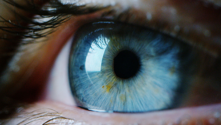 A close up of a person's blue eye at an eye clinic, Abuja