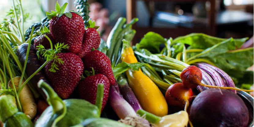 A table adorned with a variety of fruits and vegetables.