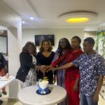 birthday celebrations with group of people cutting a cake at the best eye clinic in Abuja