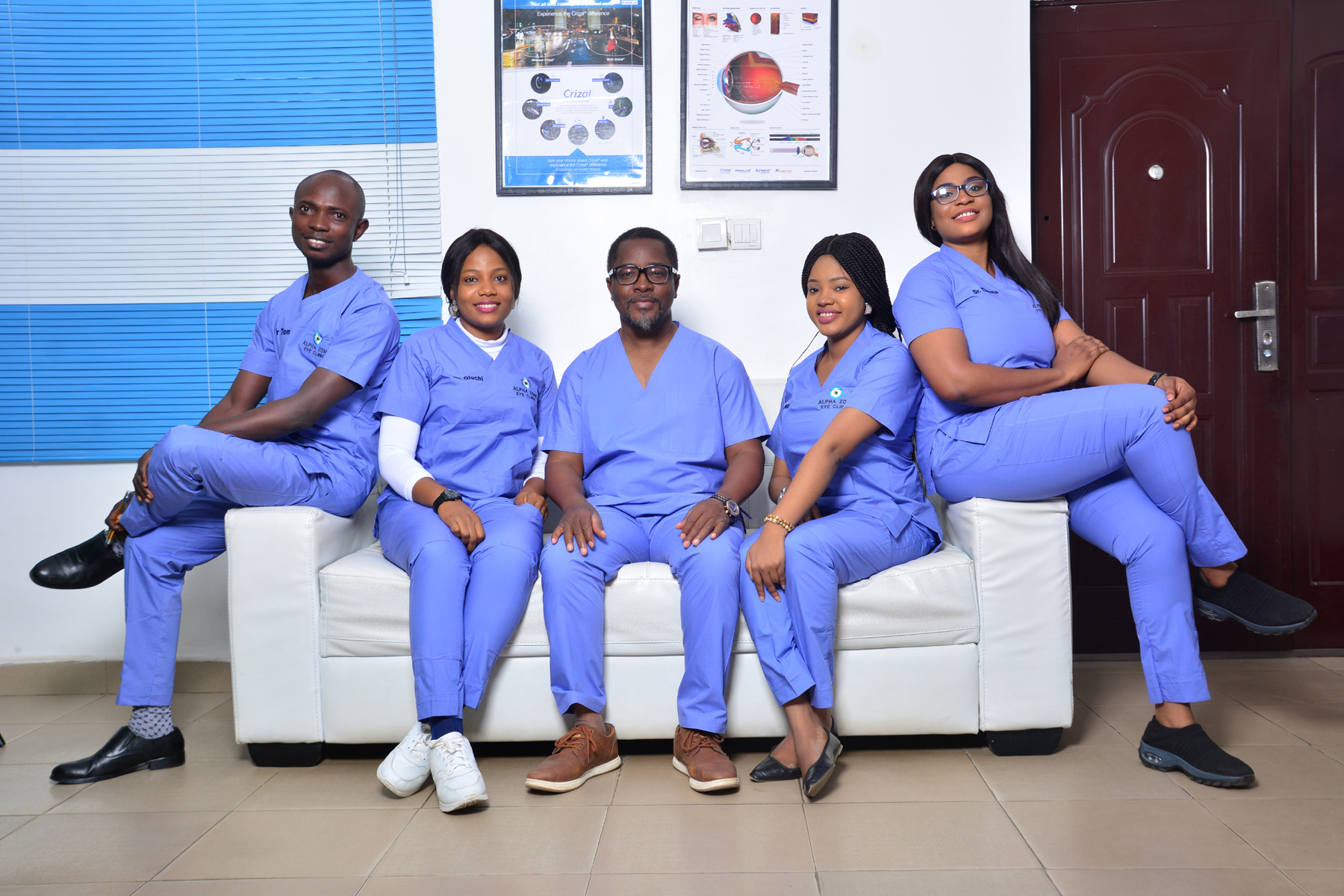 A group of doctor in blue scrubs posing for a photo at the best eye clinic in Abuja.
